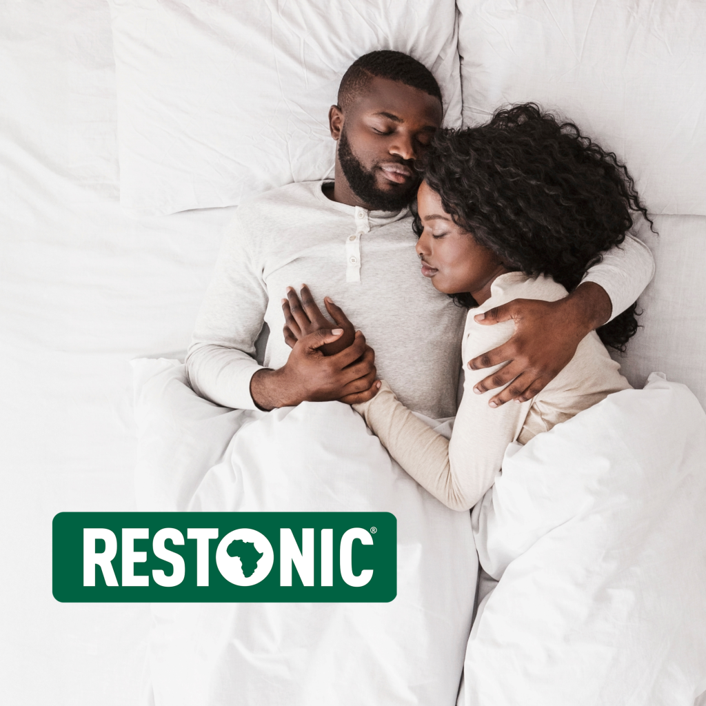 a couple sleeping on a restonic bed